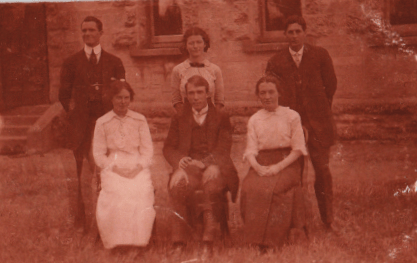 Unknown group with Doris Turpin, front left seated in all white outfit